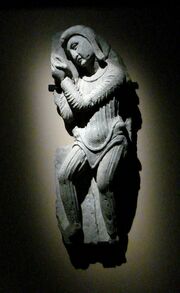Full-figure sculpture on a wall of a man
